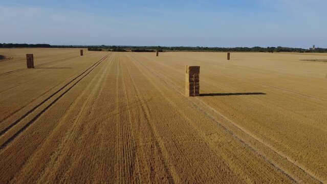 Drone shot. Haystack in freshly harvested corn field. East Yorkshire.England.UK 10.08.2022