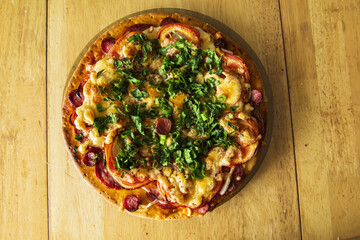 pizza with sausage and vegetables