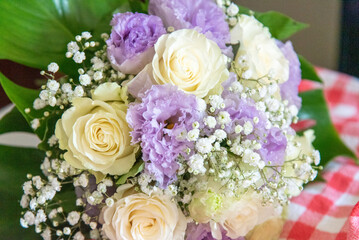 August 2022. Italy. Wedding bouquet resting on the bench