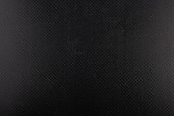 black rough plastic surface with regular artificial pimply bumps - full frame background and texture