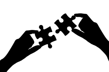 silhouette two hands of businesswomen to connect couple puzzle piece symbol of association and connection.business strategy