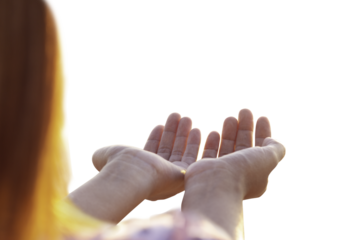 women raise her arms to pray