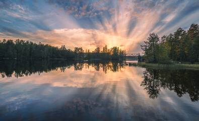 Beautiful sunset in tranquil lake at summer evening in Finland - 522456466