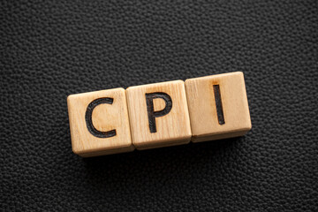 CPI - acronym from wooden blocks with letters, abbreviation CPI Consumer price index concept,...
