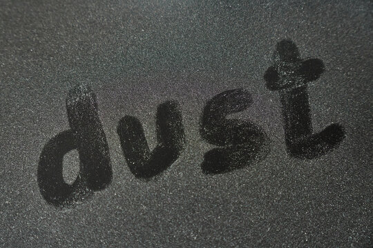 Dust, on dusty black surface