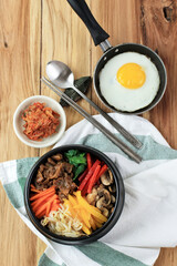 Korean Bibimbap, Nixed Rice with Vegetable, Rice, and Egg. Served with Kimchi