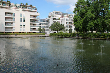 modern flat buildings and pond in nancy in france 