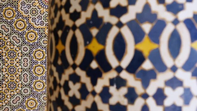 Moroccan zellige mosaic pattern in traditional Islamic geometric design in Morocco. Made with natural colors from indigo, saffron, mint, kohl. 4k Moroccan design background footage.