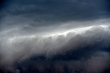 Black thunderstorm storm clouds on a summer day. Beautiful terrible thunderstorm.