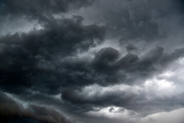 Black thunderstorm storm clouds on a summer day. Beautiful terrible thunderstorm.