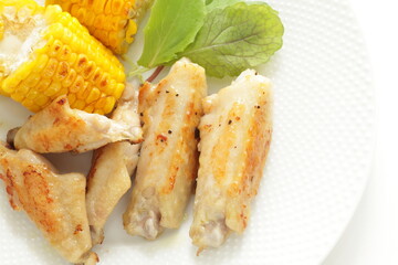 Barbecue chicken wing and sweet corn seed with salad for summer outdoor food image