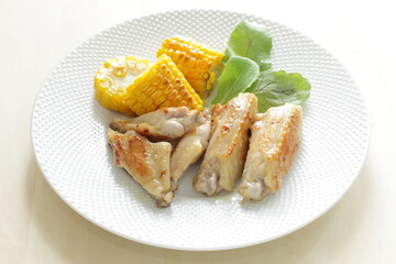 Barbecue chicken wing and sweet corn seed with salad for summer outdoor food image