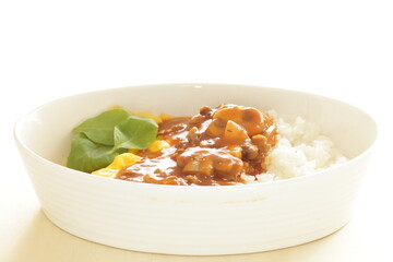 Beef stew and scrambled egg on rice with copy space