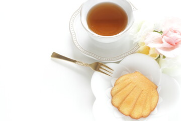 French sweet food, shell shape cake on white dish