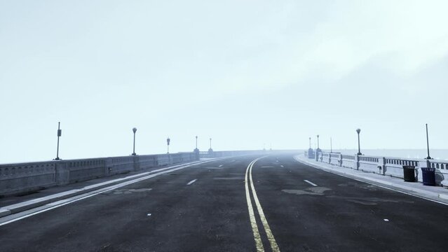 Old empty stone bridge on a foggy day