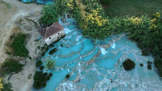 View from above, stunning aerial view of Le Cascate del Mulino, a group of beautiful hot springs in the municipality of Manciano, Tuscany