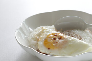 Chinese food, pan fried and soy sauce on rice for asian breakfast image