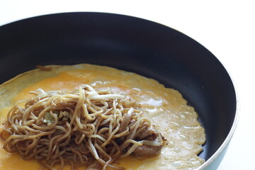 Japanese food, homemade fried noodles omelet with sauce 