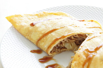 Japanese food, homemade fried noodles omelet with sauce 