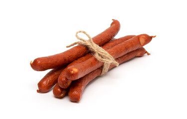 Smoked grilled thin Pork Sausages, close-up, isolated on white background