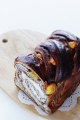 Homemade chestnut and chocolate marble bread on white background with copy space