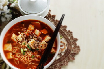 Fusion food, Chinese mapo tofu and ramen noodles in white bowl