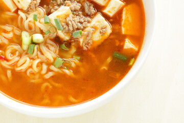 Fusion food, Chinese mapo tofu and ramen noodles in white bowl