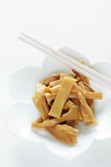 Chinese food, pickled bamboo shoots on white dish for side dish image