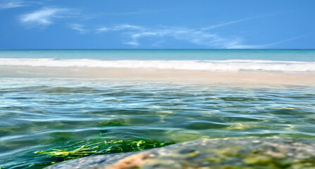 emerald green sea water  and splash, white sand beach and blue sky tropical  nature landscape defocus  background