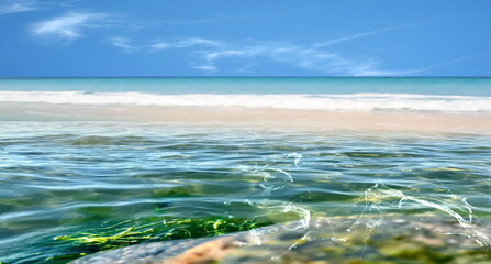 emerald green sea water  and splash, white sand beach and blue sky tropical  nature landscape defocus  background