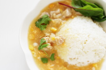 Chinese food, Chicken and sweet corn soup rice in white plate 
