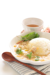 Chinese food, Chicken and sweet corn soup rice in white plate 