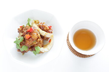 Chinese food, sour and sweet chicken with coriander leaves 