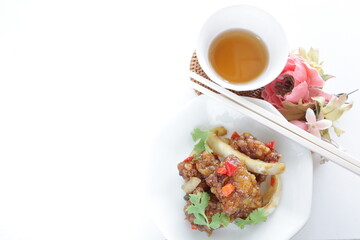 Chinese food, sour and sweet chicken with coriander leaves 
