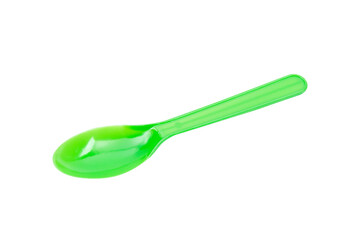 Green plastic spoon isolated on white background.