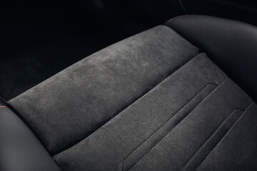 Grey alcantara texture. Close-up car seat fabric material. The surface of leatherette for textured background.  - obrazy, fototapety, plakaty