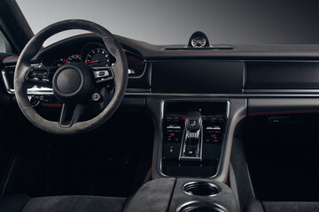 Naklejka premium Modern SUV car interior with the leather panel, multimedia, and dashboard 