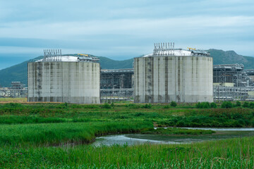 plant for the production of liquefied natural gas in a natural area against the backdrop of...