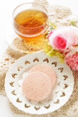 Pink color strawberry cookie and English tea