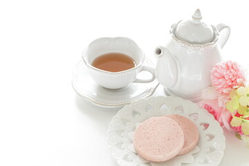 Obraz na płótnie Canvas Pink color strawberry cookie and English tea