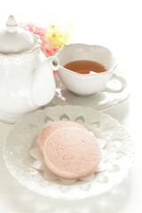 Pink color strawberry cookie and English tea
