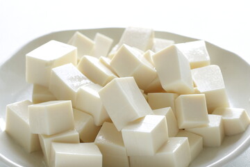 chopped Tofu on white dish with copy space for cooking ingredient 