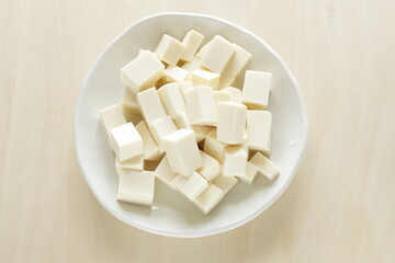 chopped Tofu on white dish with copy space for cooking ingredient 