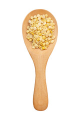 Split soybean on wooden spoon isolated on white background with clipping path.