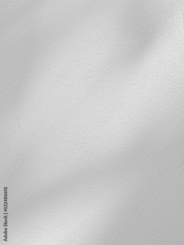 Sticker shadow on white concrete wall in the room from window with morning light