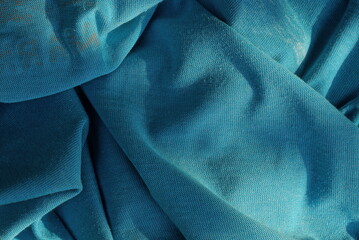 blue fabric texture from a crumpled piece of clothing