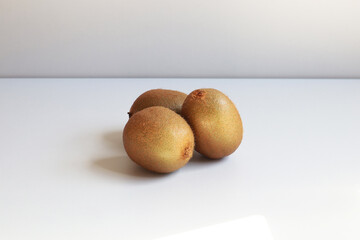 kiwi fruit on a white wooden table