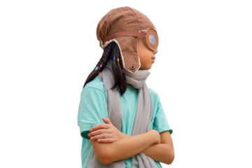 Portrait of Asian child girl in the old style pilot uniform stands with arms crossed, Happy kid playing outdoors