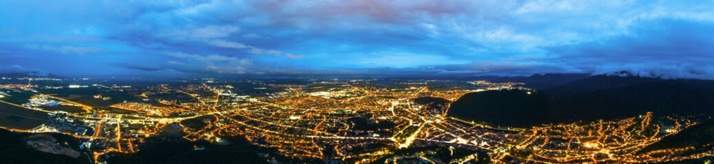 Fototapeta na wymiar Aerial drone view of Brasov at night, Romania