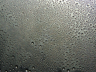 Water droplets of cold on the glass texture